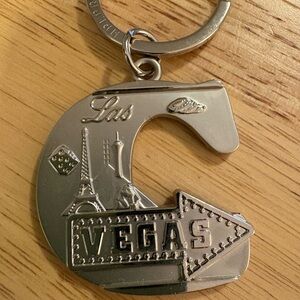 Silver Las Vegas Keychain “C” initial metal emblems of Vegas on it